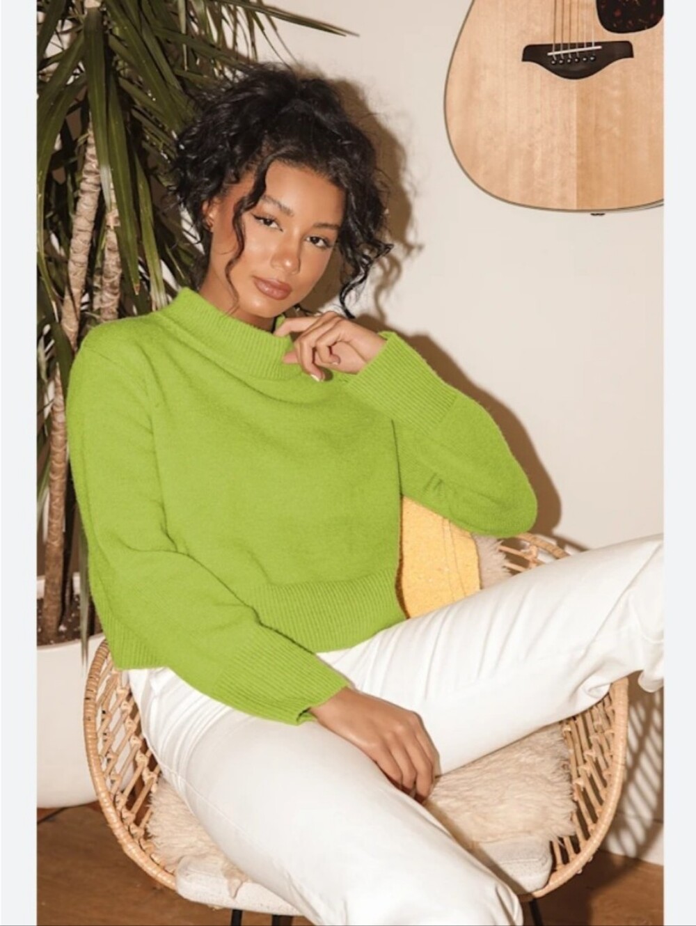 Lulu's soft green sweater with a relaxed, cropped silhouette